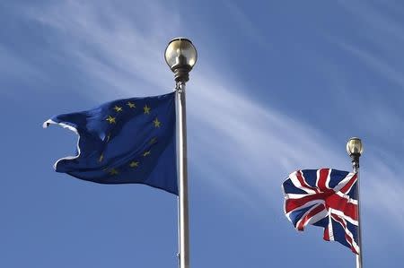 A British Union flag and an European Union flag are seen flying above offices in London, Britain, March 30, 2016. REUTERS/Toby Melville