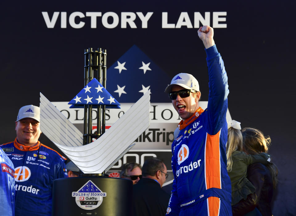 Brad Keselowski, right, celebrates in Victory Lane after winning a Monster Energy NASCAR Cup Series auto race at Atlanta Motor Speedway, Sunday, Feb. 24, 2019, in Hampton, Ga. (AP Photo/Scott Cunningham)
