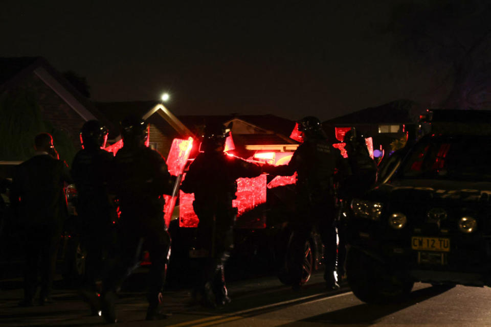 Police guard the perimeter of the Christ the Good Shepherd Church, where a stabbing occurred, in Sydney’s western suburb of Wakeley on April 15, 2024, after an angry mob converged demanding vengeance on the alleged assailant, whom police barricaded inside the church for his safety.<span class="copyright">David Gray—AFP/Getty Images</span>