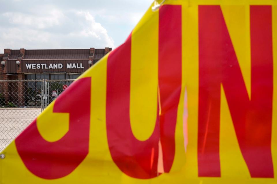 Apr 26, 2023; Columbus, Ohio, United States;  A gun show sign is seen attached to fencing which runs length of the northern side of the closed Westland Mall on Wednesday afternoon. Mandatory Credit: Joseph Scheller-The Columbus Dispatch