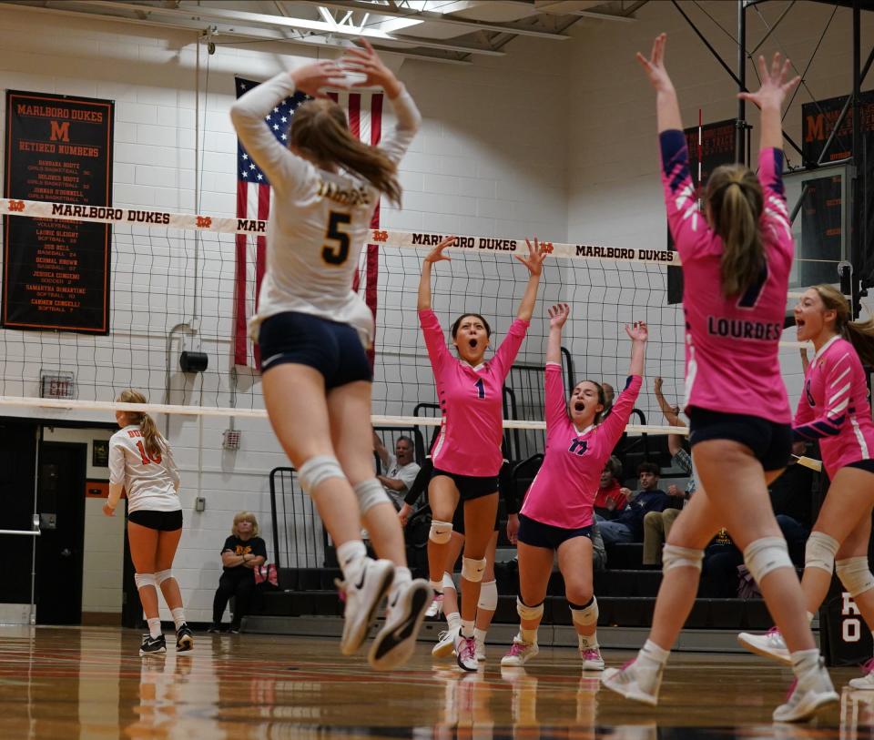 Lourdes celebrates their 3-1 win over Marlboro in volleyball action at Marlboro High School on Tuesday, October 11, 2022.