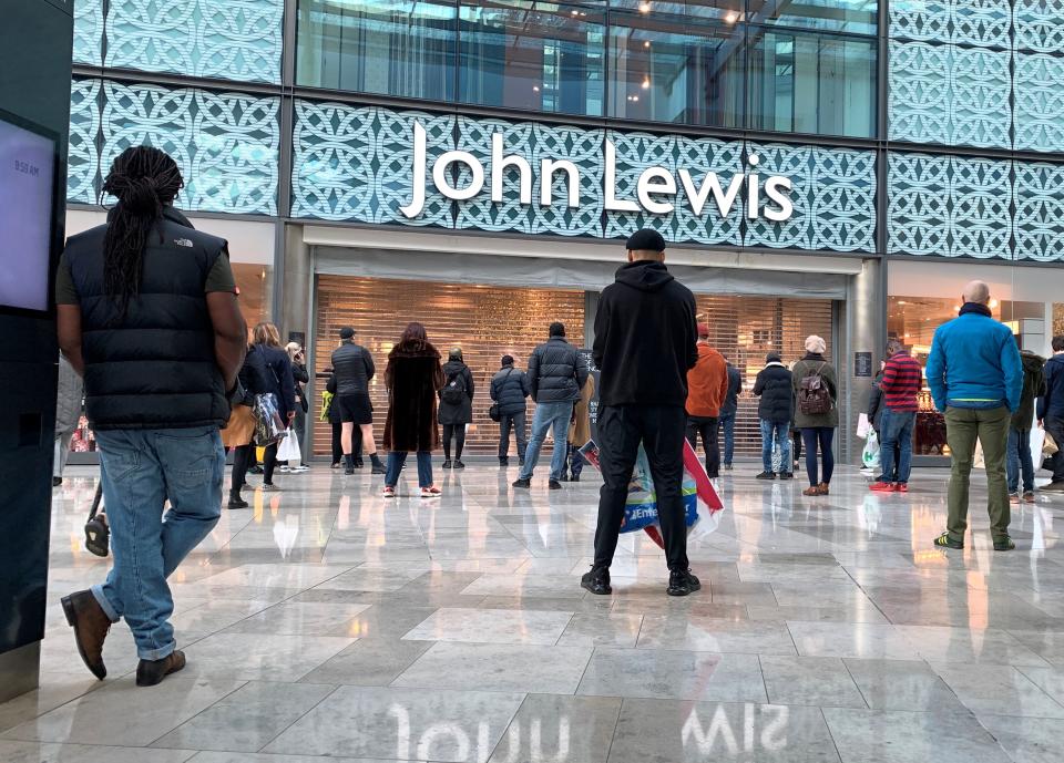 People wait for a John Lewis store to open