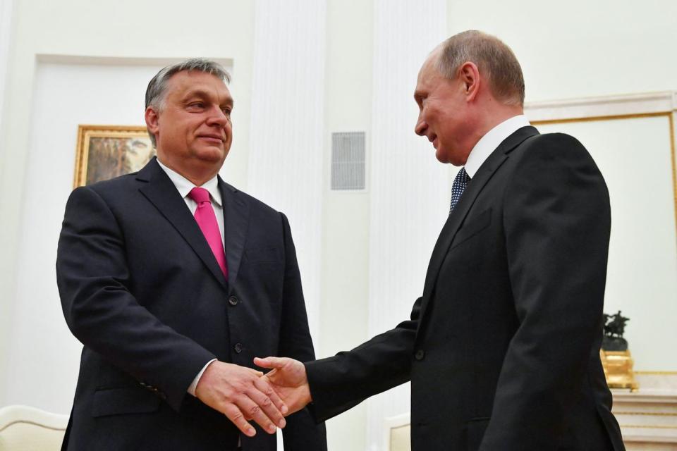 Russian President Vladimir Putin shakes hands with Hungary's Prime Minister Viktor Orban during their meeting at the Kremlin in Moscow on July 15, 2018. (Yuri Kadobnov/AFP Pool/AFP via Getty Images)