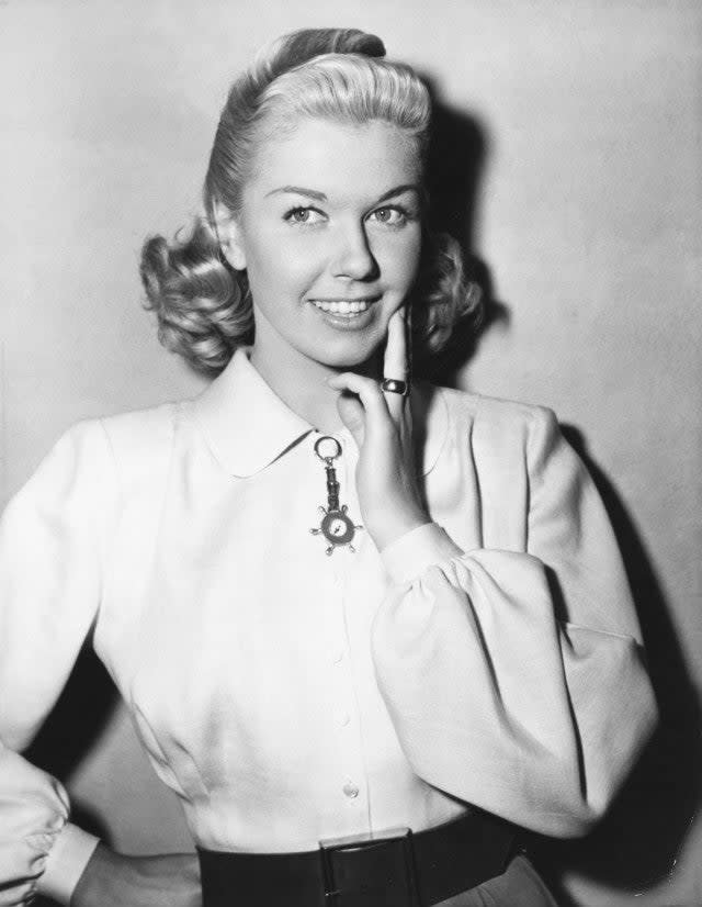 Doris Day poses for the still cameraman between scenes of 1949 Warner Bros.' Technicolor production, 