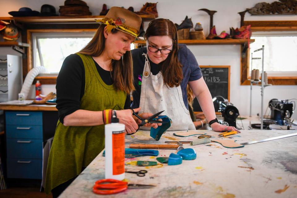 Colorado Shoe School instructor Annabel Reader, left, works with student Brenna Riley Gates at the school's workshop in Bellvue in 2022.