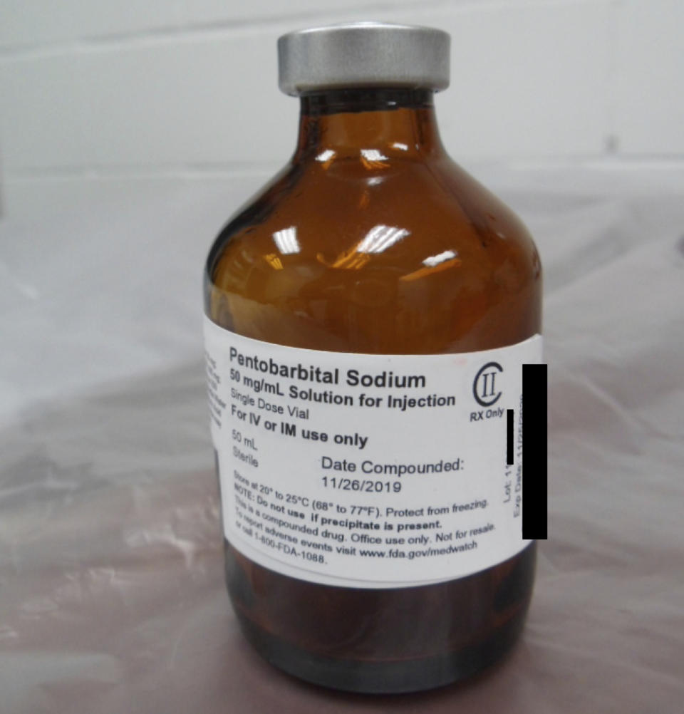 This photo provided by the U.S. Department of Justice shows a vial of pentobarbital used in the executions of two inmates in July 2020, according to court filings. The photo was filed in U.S. District Court in Washington on Aug. 13, 2020, as part of litigation over the use of pentobarbital in executions. The government redacted part of the information on the vial, after arguing it didn't want to disclose the supplier of the drug. Executioners who put 13 inmates to death in the last months of the Trump administration likened the process of dying by lethal injection to falling asleep, called gurneys “beds” and final breaths “snores.” But those tranquil accounts are at odds with AP and other media-witness reports of how prisoners’ stomachs rolled, shook and shuddered as the pentobarbital took effect inside the U.S. penitentiary death chamber in Terre Haute, Indiana. (Department of Justice via AP)
