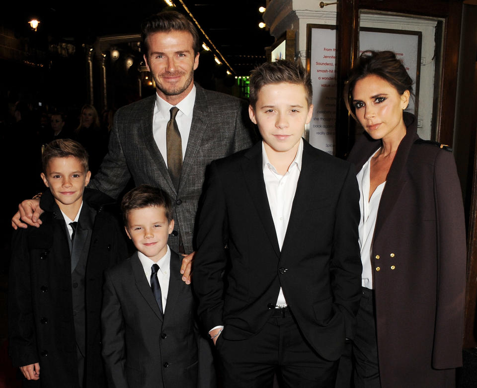David and Victoria Beckham with children Romeo, Cruz and Brooklyn at the press night performance of 'Viva Forever' in London in 2012. (Getty Images)