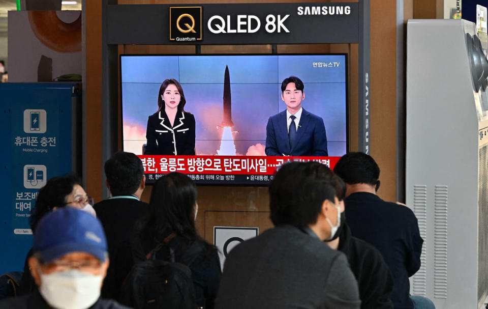 <div class="inline-image__caption"><p>People watch a television screen showing a news broadcast with file footage of a North Korean missile test at a railway station in Seoul on Nov. 2, 2022.</p></div> <div class="inline-image__credit">Jung Yeon-Je/AFP via Getty</div>