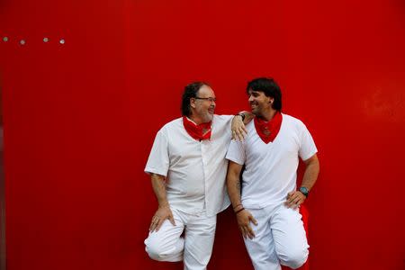 Sergio Colas and his father Txema Colas pose for a portrait during the San Fermin festival in Pamplona, northern Spain, July 9, 2016. REUTERS/Susana Vera