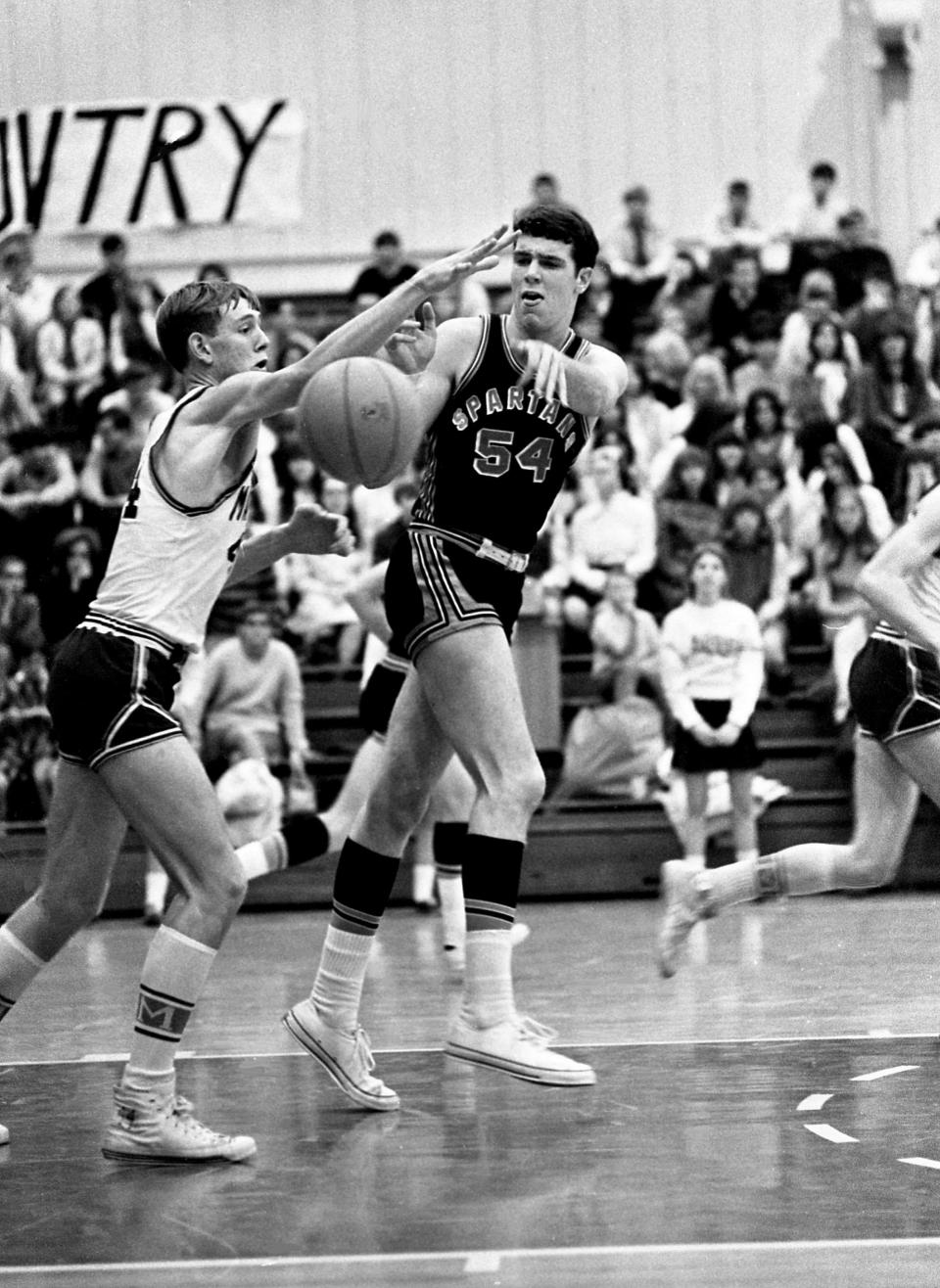 Stratford High 6-8 center Ray Maddux (54) battles with Maplewood High's Ken Lowery for control of the ball. Maddux, with 25 points and 21 rebounds, led Stratford to a 63-49 win on the road against Maplewood on Dec. 10, 1968.