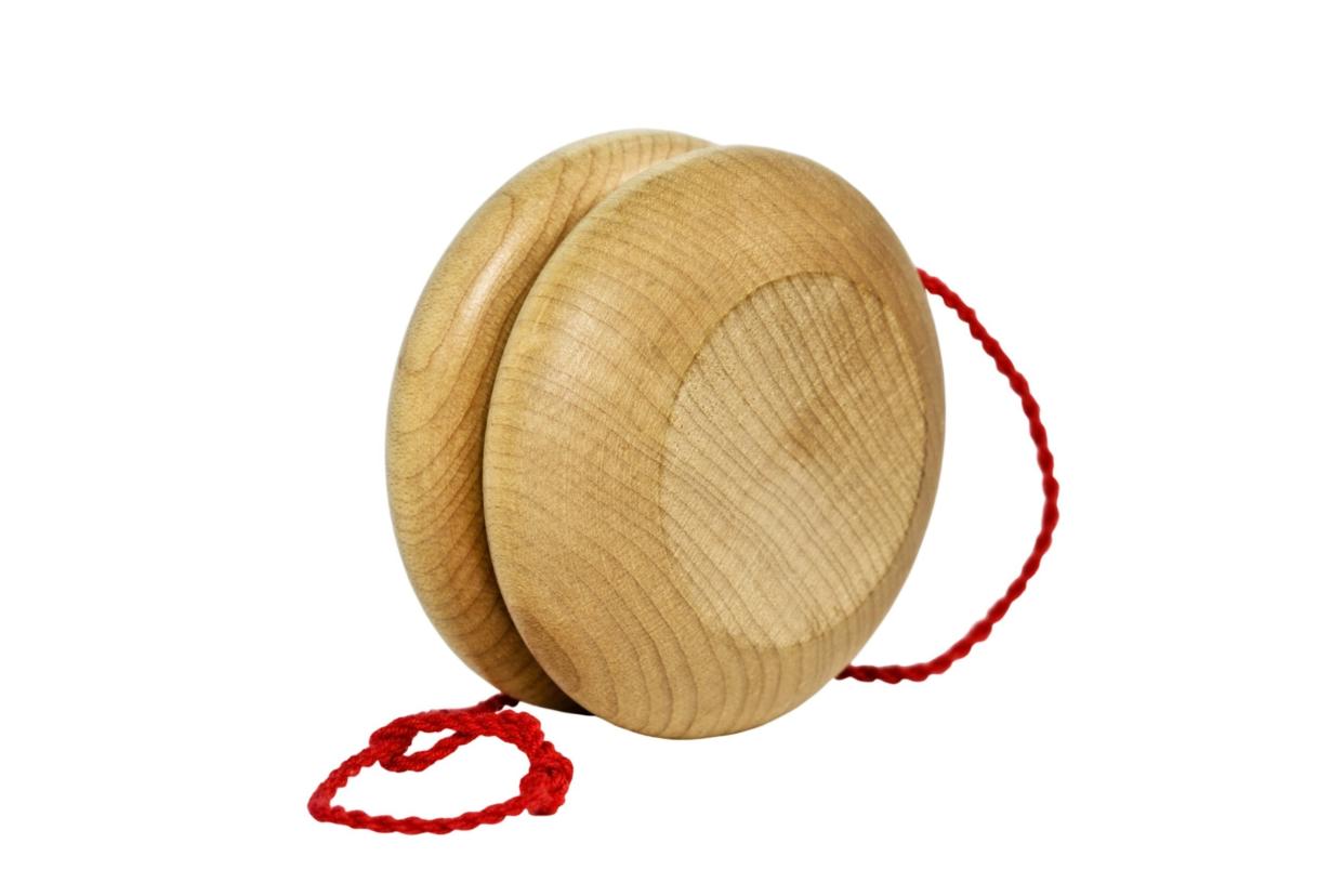 Vintage wooden yo-yo with red string