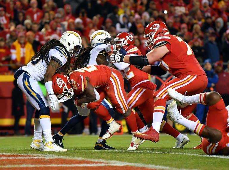 Running back Kareem Hunt of the Kansas City Chiefs carries the ball over the goal line for a touchdown during the game against the Los Angeles Chargers