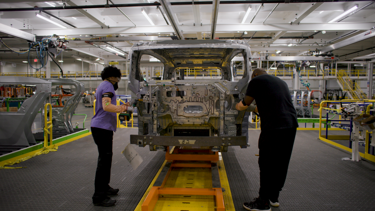 Employees at Factory Zero in Detroit and Hamtramck assemble an early model Cruise Origin, a self-driving vehicle.
