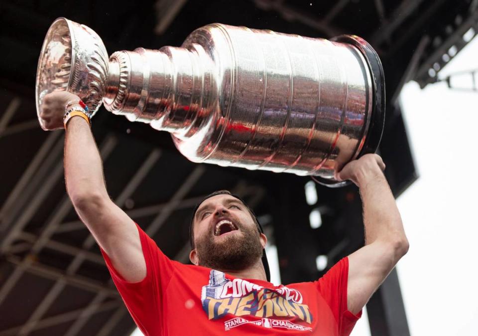 Florida Panthers defenseman Aaron Ekblad (5) lifts the Stanley Cup during a victory parade rally at the Fort Lauderdale Beach Park off A1A on Sunday, June 30, 2024, in Fort Lauderdale, Fla. The parade was held to celebrate the Florida Panthers after they defeated the Edmonton Oilers in Game 7 of the Stanley Cup Final.