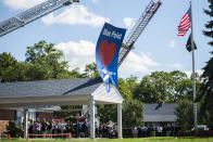 CORRECTS TO FUNERAL HOME VIEWING INSTEAD OF FUNERAL People attend the funeral home viewing of Gabby Petito at Moloney's Funeral Home in Holbrook, N.Y. Sunday, Sept. 26, 2021. (AP Photo/Eduardo Munoz Alvarez)