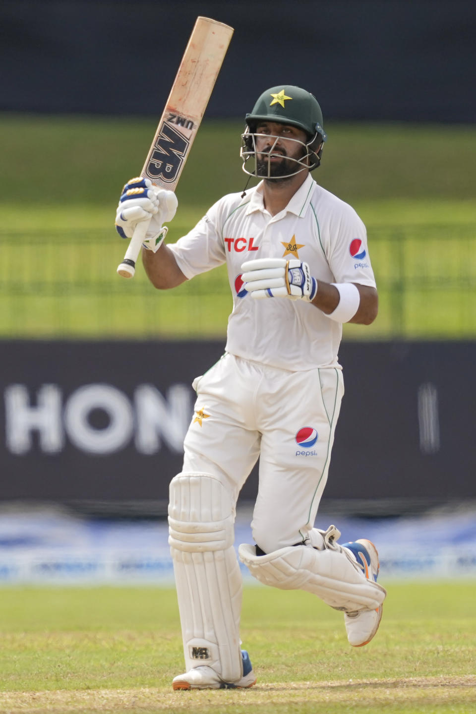Pakistan's Abdullah Shafique celebrates scoring a century during the third day of the second cricket test match between Sri Lanka and Pakistan in Colombo, Sri Lanka on Wednesday, Jul. 26. (AP Photo/Eranga Jayawardena)