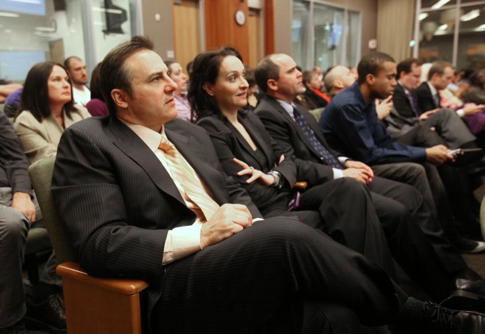 Gavin Maloof, left, co-owner of the Sacramento Kings, listens as a new sports and entertainment arena plan is discussed during a Sacramento City Council meeting where a vote was scheduled to be taken on a new sports arena proposal, in Sacramento, Calif. Tuesday, March 6, 2012. (AP Photo/Rich Pedroncelli)