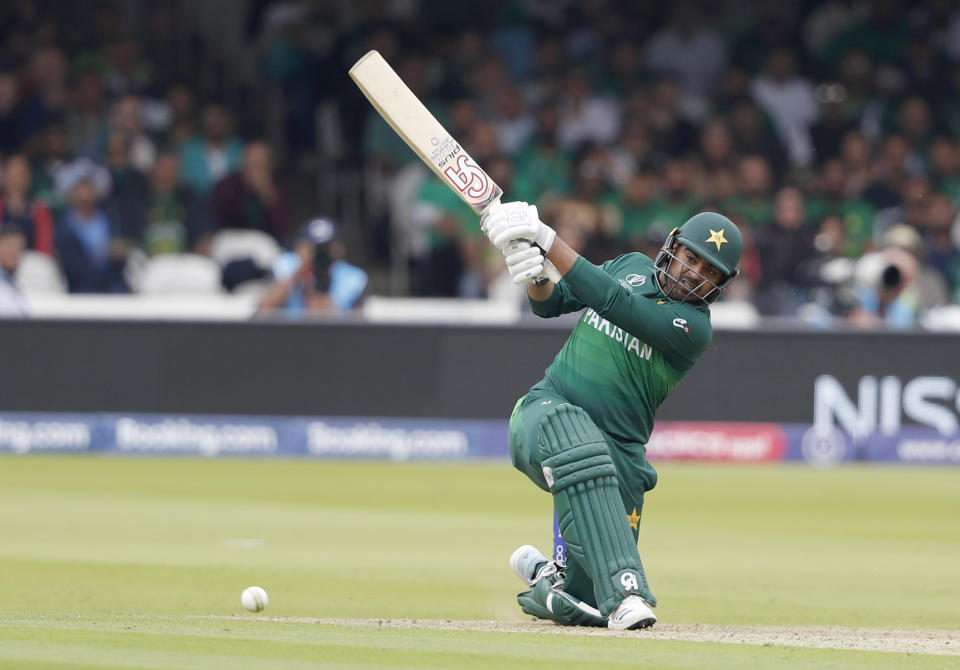 Pakistan's Haris Sohail hits 4 runs off the bowling of South Africa's Andile Phehlukwayo during their Cricket World Cup match between Pakistan and South Africa at Lord's cricket ground in London, Sunday, June 23, 2019. (AP Photo/Alastair Grant)