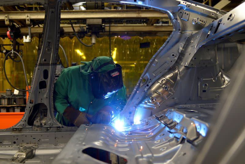 FILE PHOTO: Line workers spot weld parts of the frame on the flex line at Nissan Motor Co's automobile manufacturing plant in Smyrna Tennessee