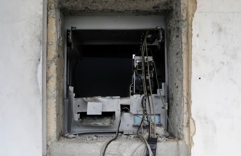 A destroyed ATM cash machine is pictured in the Lekki district of the commercial capital Lagos