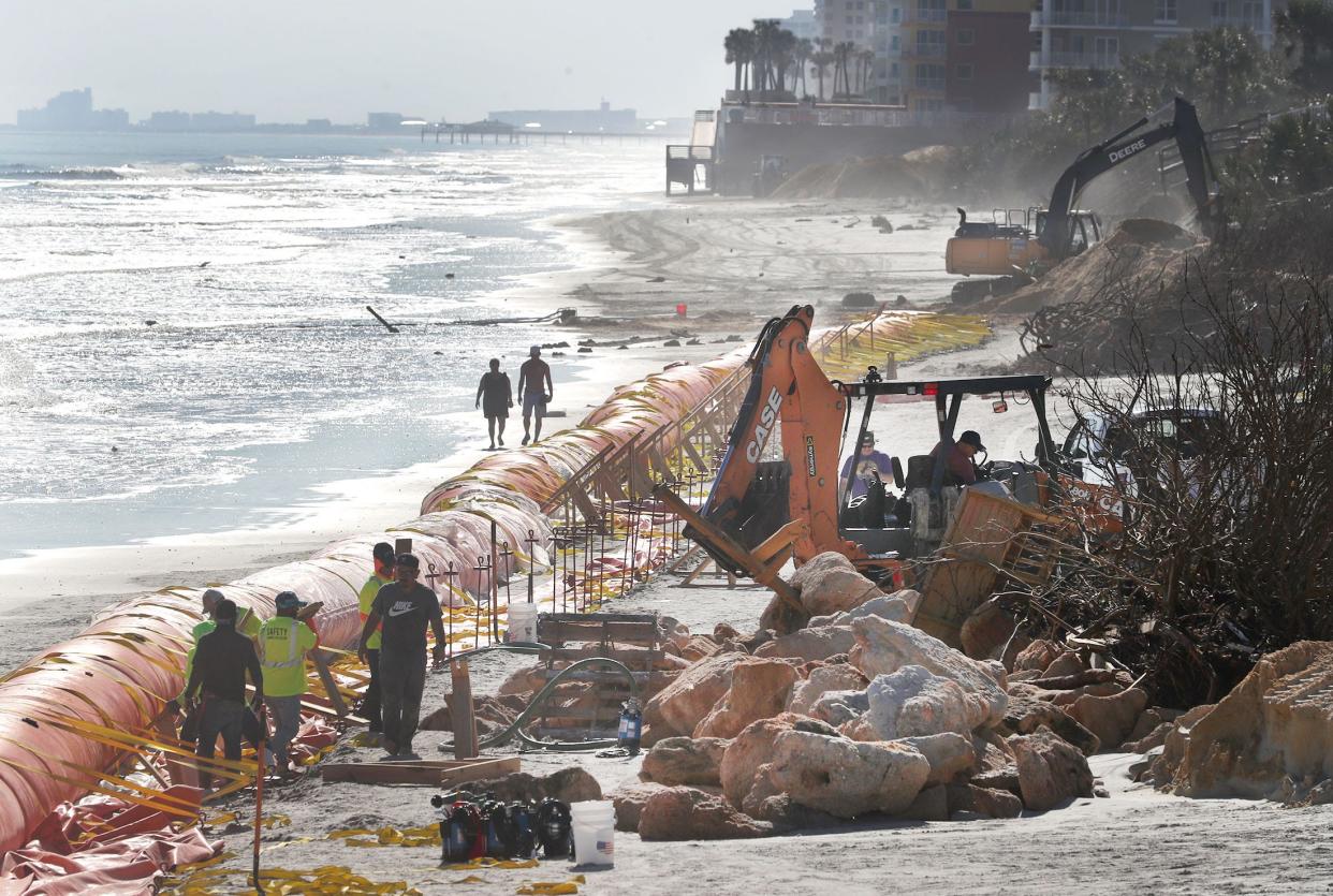 Construction crews install a Tiger Dam system Tuesday, Nov. 29, 2022, south of Frank Rendon Park in Daytona Beach Shores. The system is intended to offer a temporary protection against future erosion caused by storms.