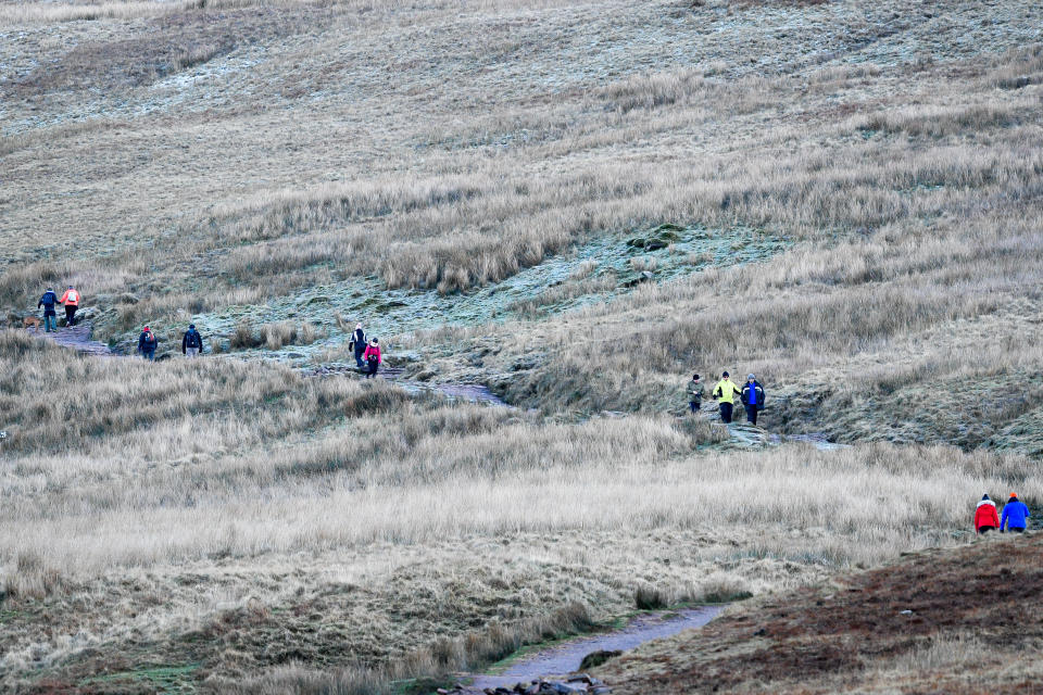 Walkers braving the cold on Pen y Fan mountain in the Brecon Beacons National Park yesterday (PA)