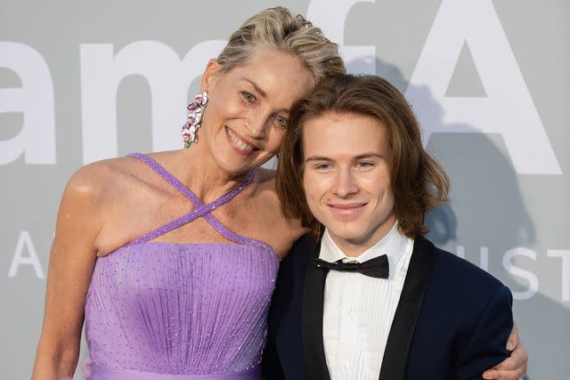 <p>Samir Hussein/WireImage</p> Sharon Stone and her son Roan at the amfAR Cannes Gala 2021