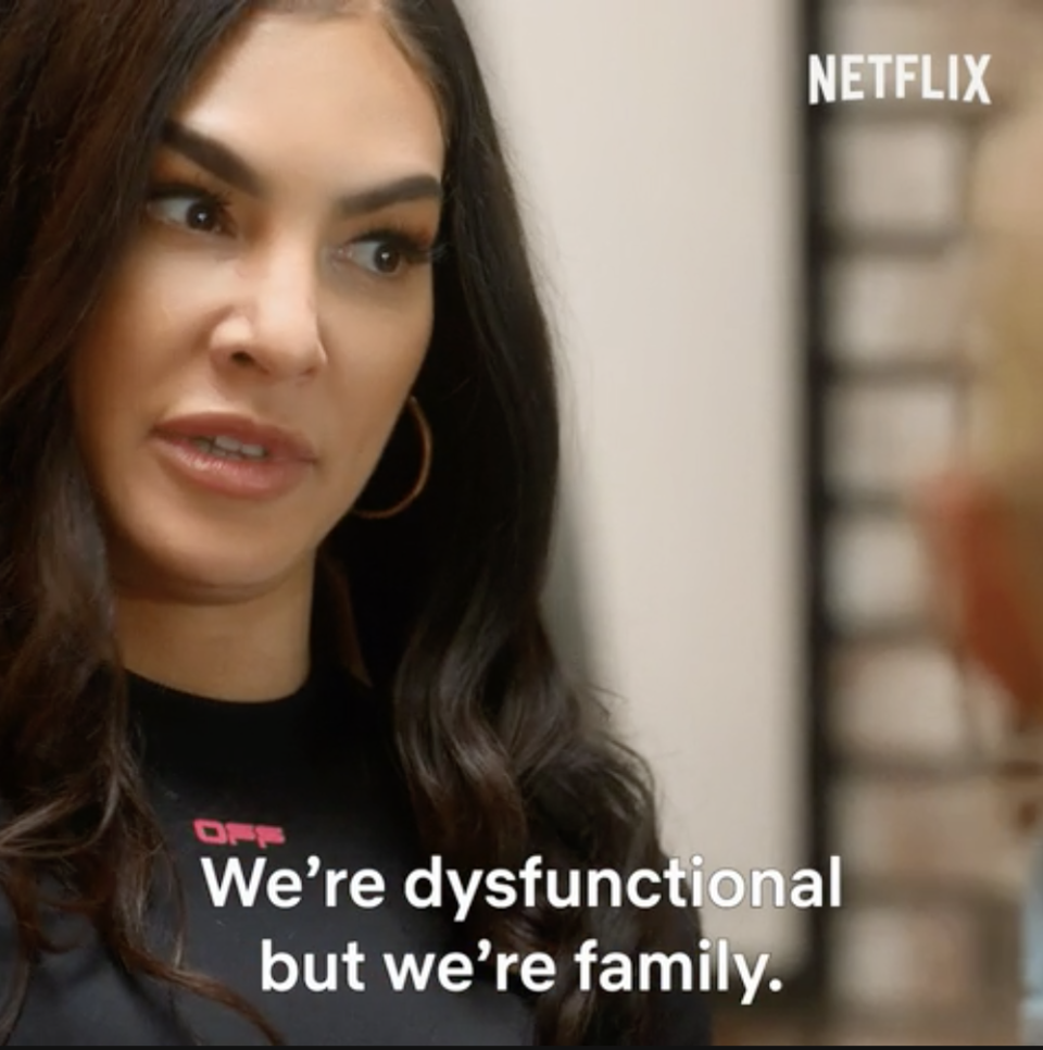 Woman on a Netflix show with subtitle text "We're dysfunctional but we're family."