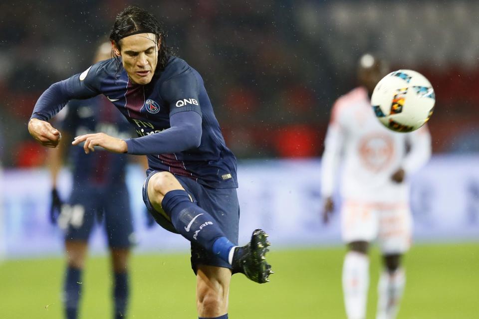 PSG's Edinson Cavani kicks the ball during their French League One soccer match between PSG and Lorient at the Parc des Princes stadium in Paris, France, Wednesday, Dec. 21, 2016. (AP Photo/Francois Mori)