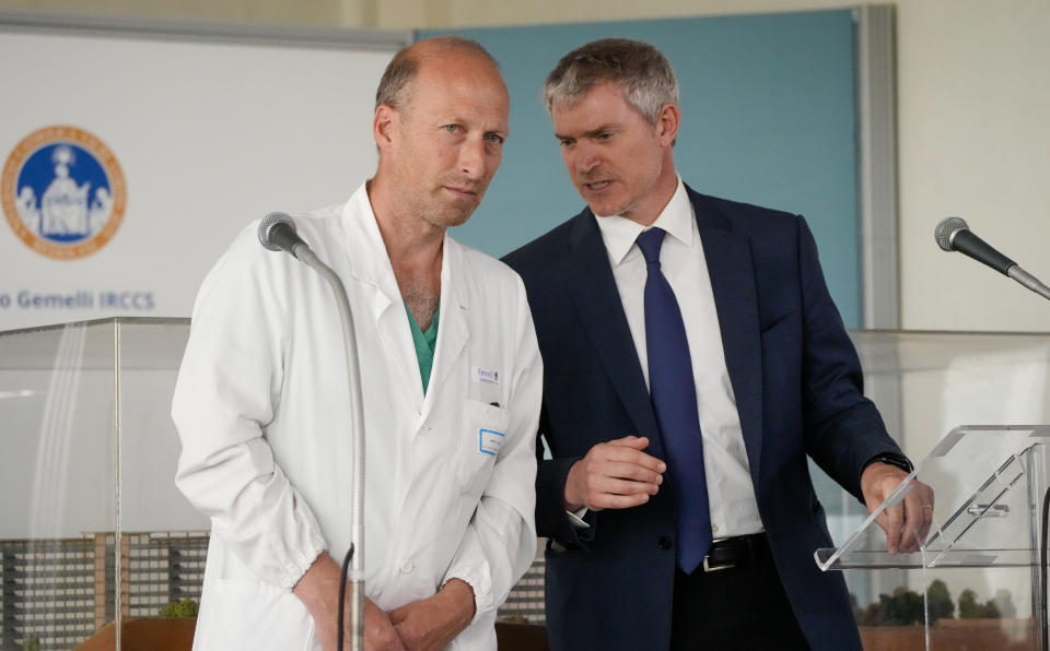 Surgeon Sergio Alfieri, left, listens to pope's spokeperson Matteo Bruni during a media briefing Saturday, June 10, 2023, about Pope Francis' health conditions after his operation at Rome's Agostino Gemelli University Polyclinic, on Wednesday. Pope Francis, who underwent surgery Wednesday to repair a hernia in his abdominal wall, is following a careful convalescence which aims at reducing the effort of the abdominal wall, to allow the implanted prosthetic mesh and the repair of the muscular fascia to heal optimally. (AP Photo/Alessandra Tarantino)