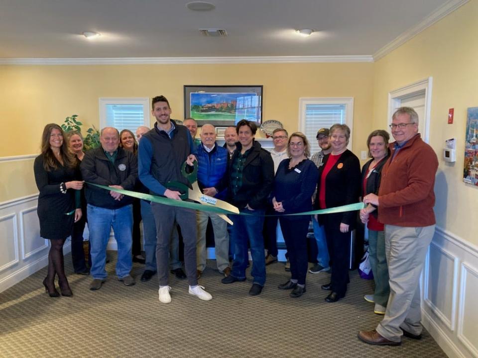 Ryan Coburn of Forge Financial joins GDCC staff, Ambassadors, Board members, and local officials for his ribbon-cutting ceremony at the Chamber.