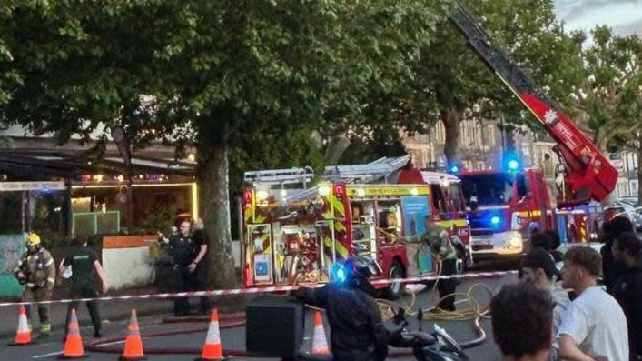 Two fire engines outside the restaurant on Gloucester Road