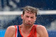 <p>Norway's Anders Berntsen Mol pours water on himself after winning their men's beach volleyball quarter-final match between Russia and Norway during the Tokyo 2020 Olympic Games at Shiokaze Park in Tokyo on August 4, 2021. (Photo by Martin BERNETTI / AFP)</p> 