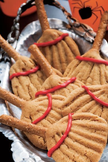 <p>Use fork tines and pretzel sticks to turn your already yummy peanut butter cookies into fun witches' broomsticks. </p><p>Get the <strong><a href="https://www.womansday.com/food-recipes/food-drinks/a28860048/broom-cookies-recipe/" rel="nofollow noopener" target="_blank" data-ylk="slk:Broom Cookies recipe;elm:context_link;itc:0;sec:content-canvas" class="link ">Broom Cookies recipe</a></strong>.</p>