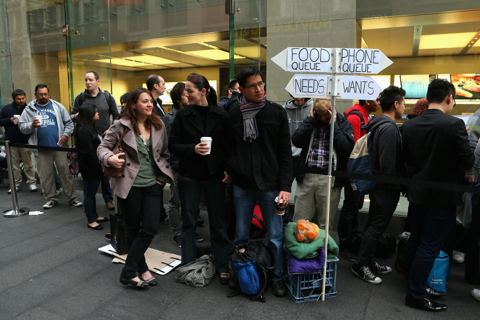 SYDNEY, AUSTRALIA - SEPTEMBER 21: Customers queue up to purchase the iPhone 5 smartphone at the Apple flagship store on George street on September 21, 2012 in Sydney, Australia. Australian Apple stores are the first in the world to receive and sell the new iPhone 5 handsets. (Photo by Cameron Spencer/Getty Images)