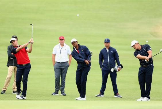 Justin Thomas, Tiger Woods and Bryson DeChambeau practice at Royal Melbourne (EPA)