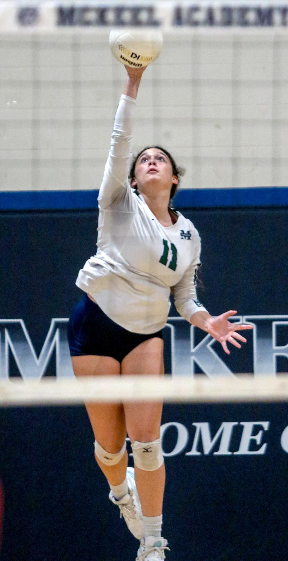 McKeel's Juleigh Urbina puts up a serve against Discovery in the Class 4A, District 8 semifinals.