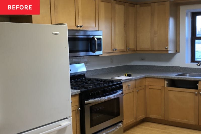 Kitchen with gray counters and tan cabinetry