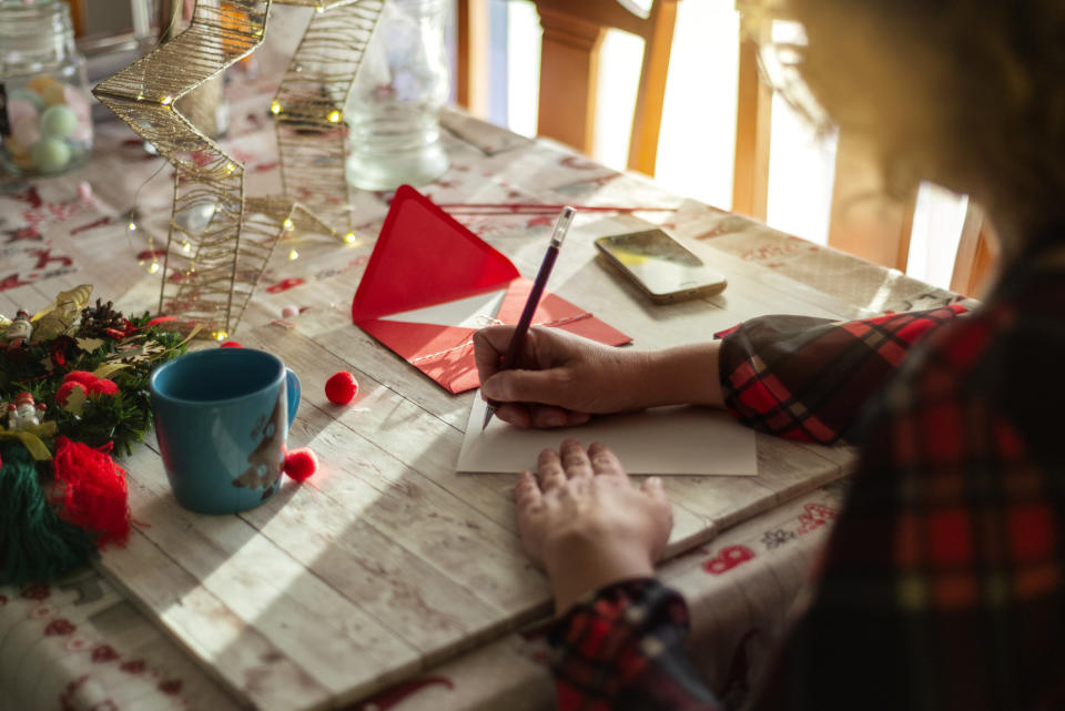 A woman writing a card