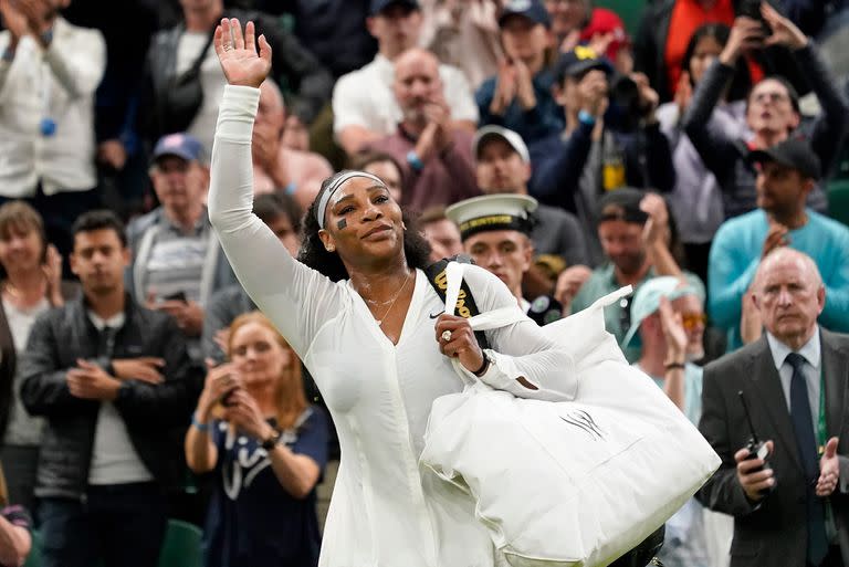 Serena Williams walks off the court after being defeated by Harmony Tan in the second round of Wimbledon 2022.