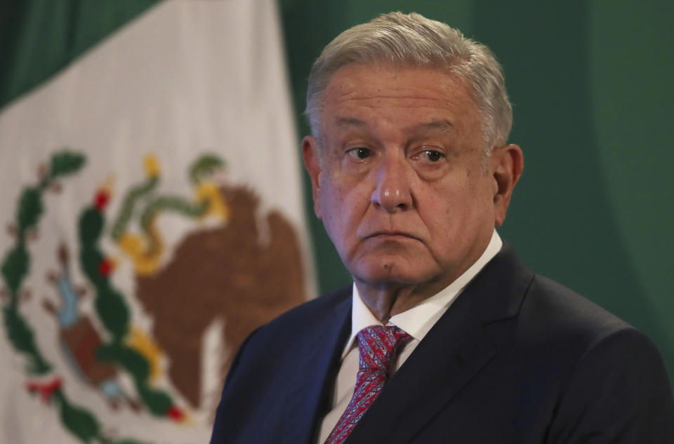 Mexican President Andrés Manuel López Obrador gives his daily morning press conference following a two-week absence after he tested positive for coronavirus, at the presidential palace, Palacio Nacional, in Mexico City, Monday, Feb. 8, 2021. (AP Photo/Marco Ugarte)