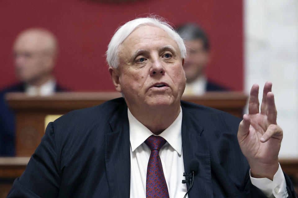 FILE - West Virginia Gov. Jim Justice delivers his annual State of the State address in the House Chambers at the state capitol in Charleston, W.Va., on Jan. 11, 2023. Justice signed a bill Monday, March 13, 2023, that makes interfering with a police officer and causing their death a felony punishable by up to life in prison. (AP Photo/Chris Jackson, File)