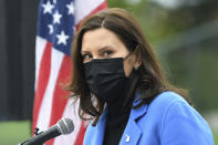 FILE - In this April 12, 2021 file photo, Michigan Governor Gretchen Whitmer U.S. talks about the statewide COVID-19 vaccination effort during a press conference in Ypsilanti, Mich. A recent spike in coronavirus cases in some states has led one of the nation's top health experts to suggest that governors could “close things down” like they did during previous surges. But that doesn't appear likely to happen — not even in states led by Democratic governors who favored greater restrictions in the past. (Lon Horwedel/Detroit News via AP, File)