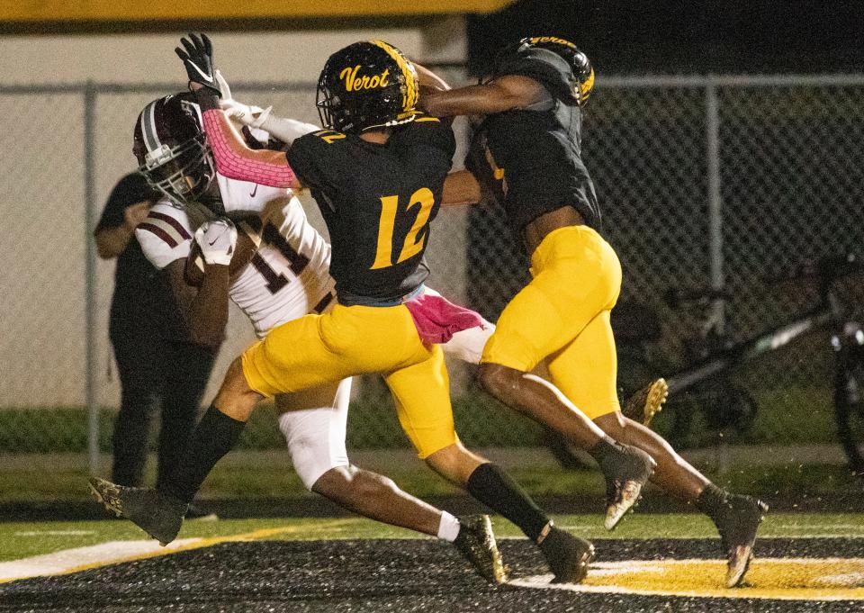 Parker Turner and Chris Graves of Bishop Verot try to stop a pass intended for Olsen Henry of First Baptist Academyin the end zone on Friday, Oct. 15, 2021, at Bishop Verot High School in Fort Myers. The play was not called a touchdown.