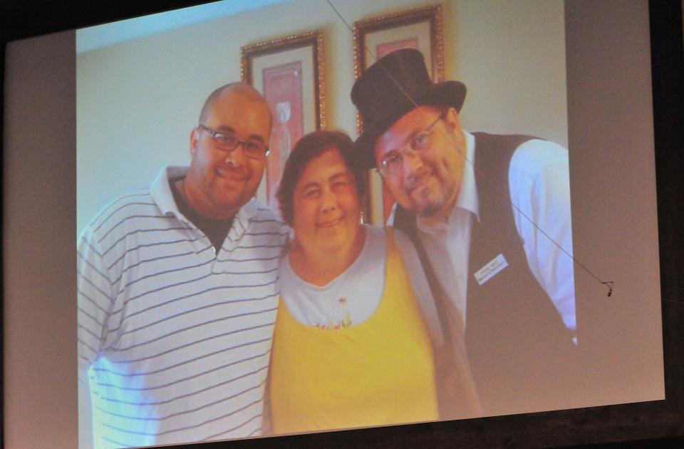 Guest speaker Steventhen Holland, an author, recording artist, worship leader, motivational speaker and founder of “Broken Not Dead” ministries, shows a photo with his mother and uncle was during a Sanctity of Human Life Sunday Community Service on Sunday, Jan. 16, 2022 at Bethel Baptist Church in Savannah.