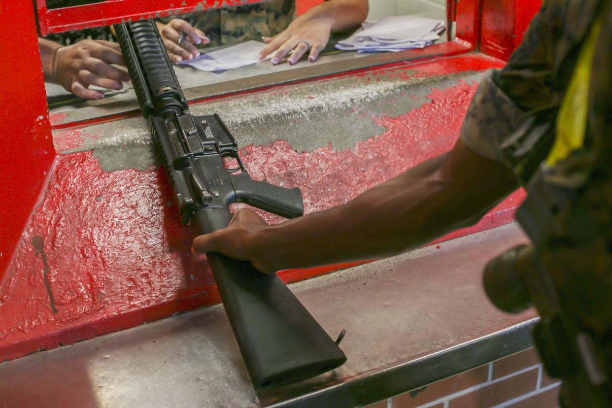 In this June 21, 2019, photo made available by the U.S. Marine Corps, a recruit receives a rifle at Marine Corps Recruit Depot, Parris Island, S.C. The armory is in charge of over 10,000 rifles on Parris Island. In the first public accounting of its kind in decades, an Associated Press investigation has found that at least 1,900 U.S. military firearms were lost or stolen during the 2010s, with some resurfacing in violent crimes. AP’s total is a certain undercount of a problem some armed services have downplayed. (Lance Cpl. Ryan Hageali/U.S. Marine Corps via AP)