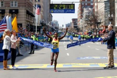 Apr 18, 2016; Boston, MA, USA; Atsede Baysa of Ethiopia breaks the tape to win the 120th Boston Marathon. Mandatory Credit: Greg M. Cooper-USA TODAY Sports