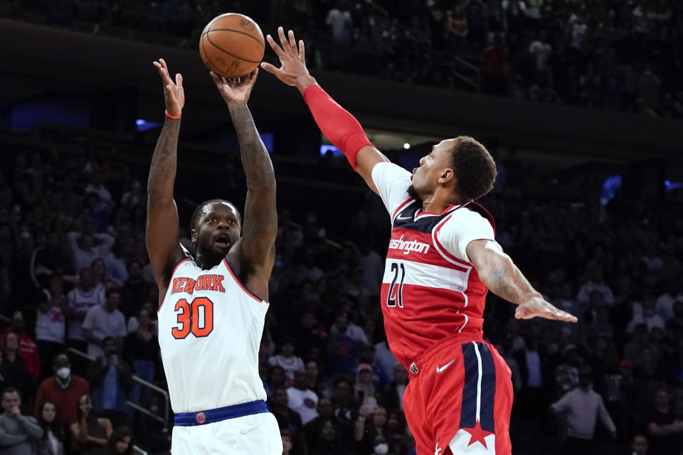 New York Knicks forward Julius Randle (30) shoots the go-ahead 3-pointer Washington Wizards center Daniel Gafford (21) in an NBA basketball game Friday, Oct. 15, 2021, at Madison Square Garden in New York. (AP Photo/Mary Altaffer)