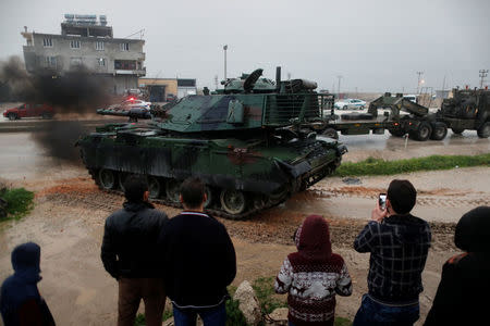 A Turkish military convoy arrives at an army base in the border town of Reyhanli near the Turkish-Syrian border in Hatay province, Turkey January 17, 2018. REUTERS/Osman Orsal