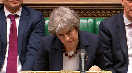 Britain's Prime Minister Theresa May reacts as the leader of the Labour Party Jeremy Corbyn responds to her address to the House of Commons on her government's reaction to the poisoning of former Russian intelligence officer Sergei Skripal and his daughter Yulia in Salisbury, in London, March 14, 2018. Parliament TV handout via REUTERS